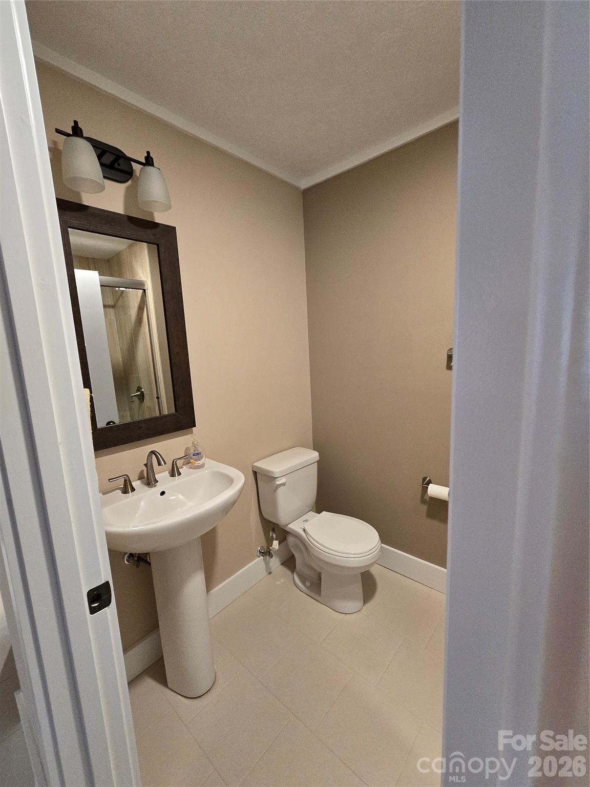 100 Chapel Road Black Mountain, NC 28711 - Photo 21 of 30 a white toilet sitting next to a bathroom sink