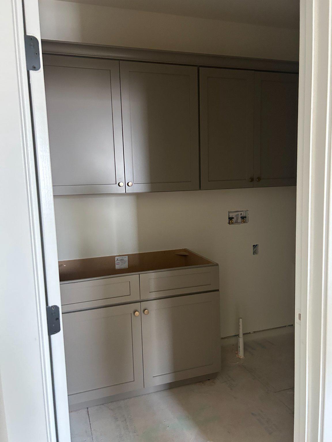 109 Sellew Road Annapolis, MD 21401 - Photo 6 of 15 Modern laundry room with sleek cabinetry.