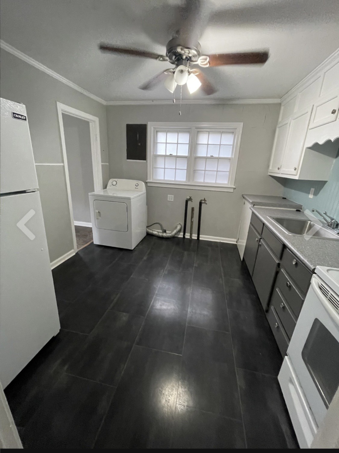 635 Cleveland Street Pulaski, TN 38478 - Photo 4 of 10 a view of a livingroom with furniture window wooden floor and a kitchen