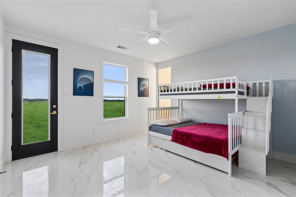 1053 Sedalia Road Van Alstyne, TX 75495 - Photo 25 of 40 a bedroom with a bed and a window