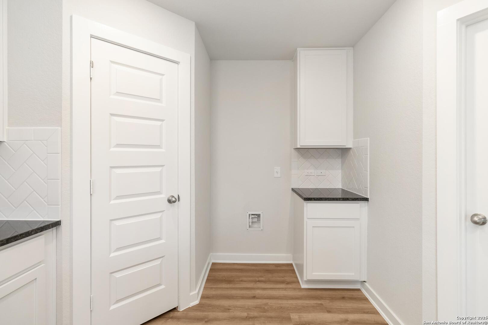 10303 Apple Pie Road San Antonio, TX 78224 - Photo 11 of 31 a view of cabinets and wooden floor