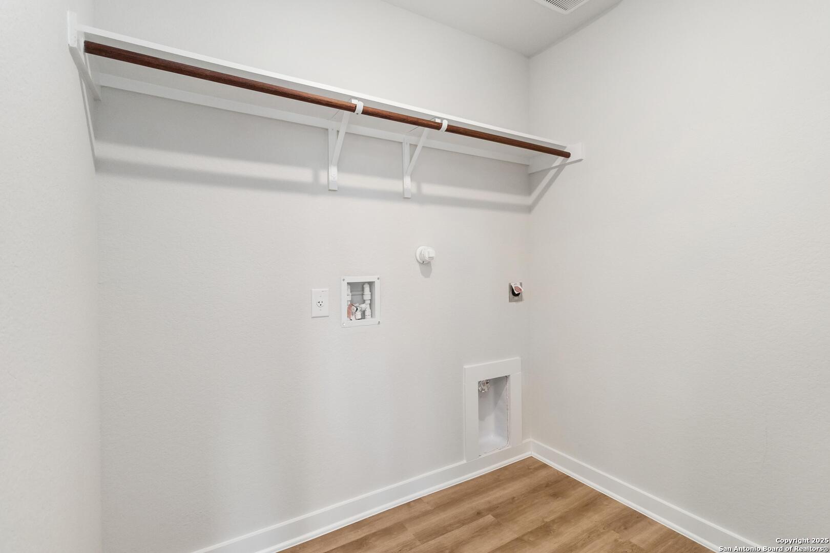 10303 Apple Pie Road San Antonio, TX 78224 - Photo 13 of 31 a view of small space with racks on the wall