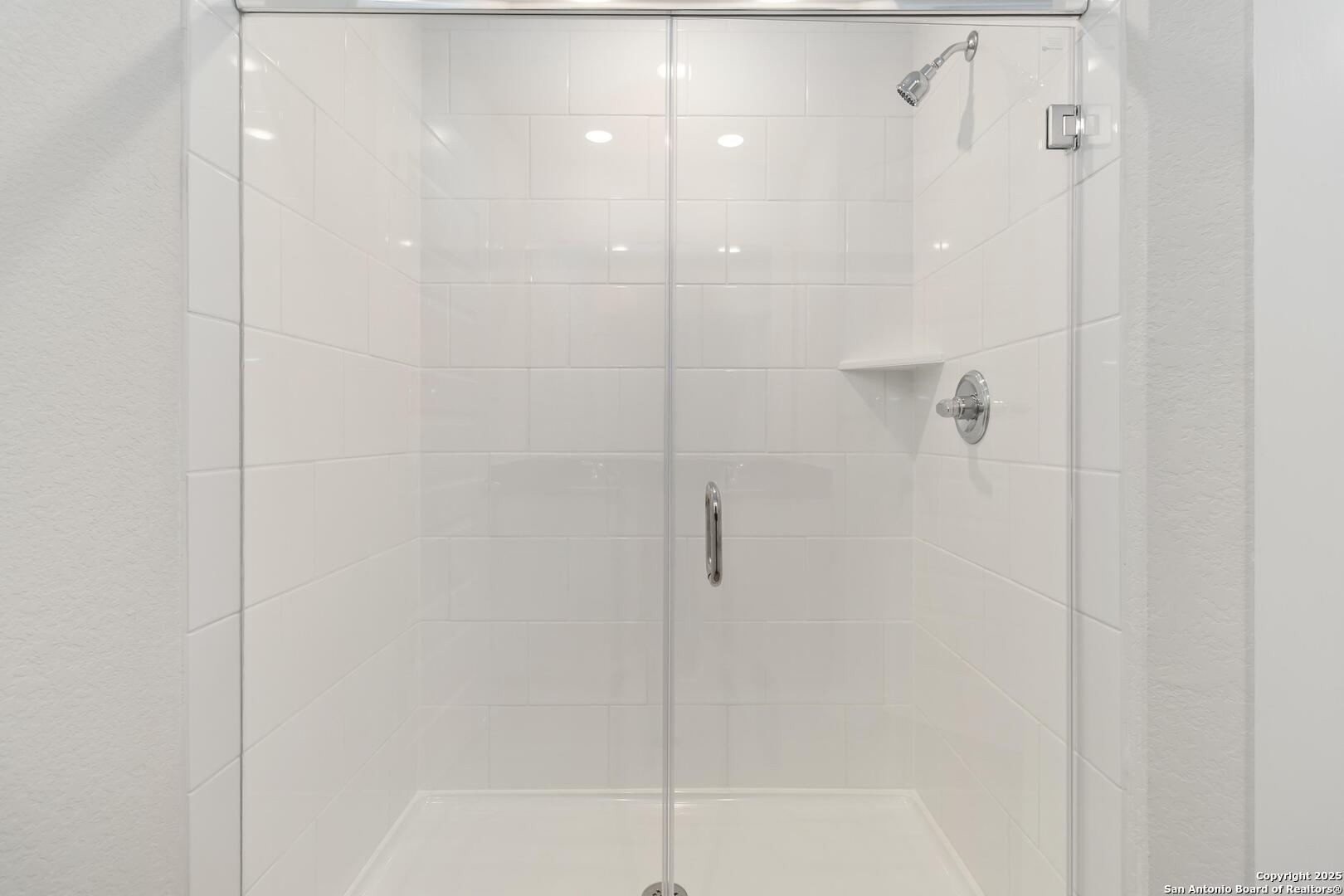 10303 Apple Pie Road San Antonio, TX 78224 - Photo 18 of 31 a bathroom with a shower