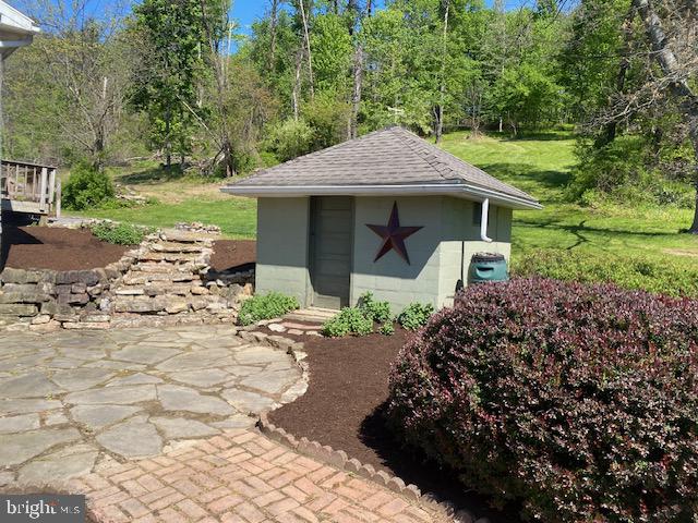 64 Metz Road Thompsontown, PA 17094 - Photo 61 of 69 Charming garden shed with rustic flair.