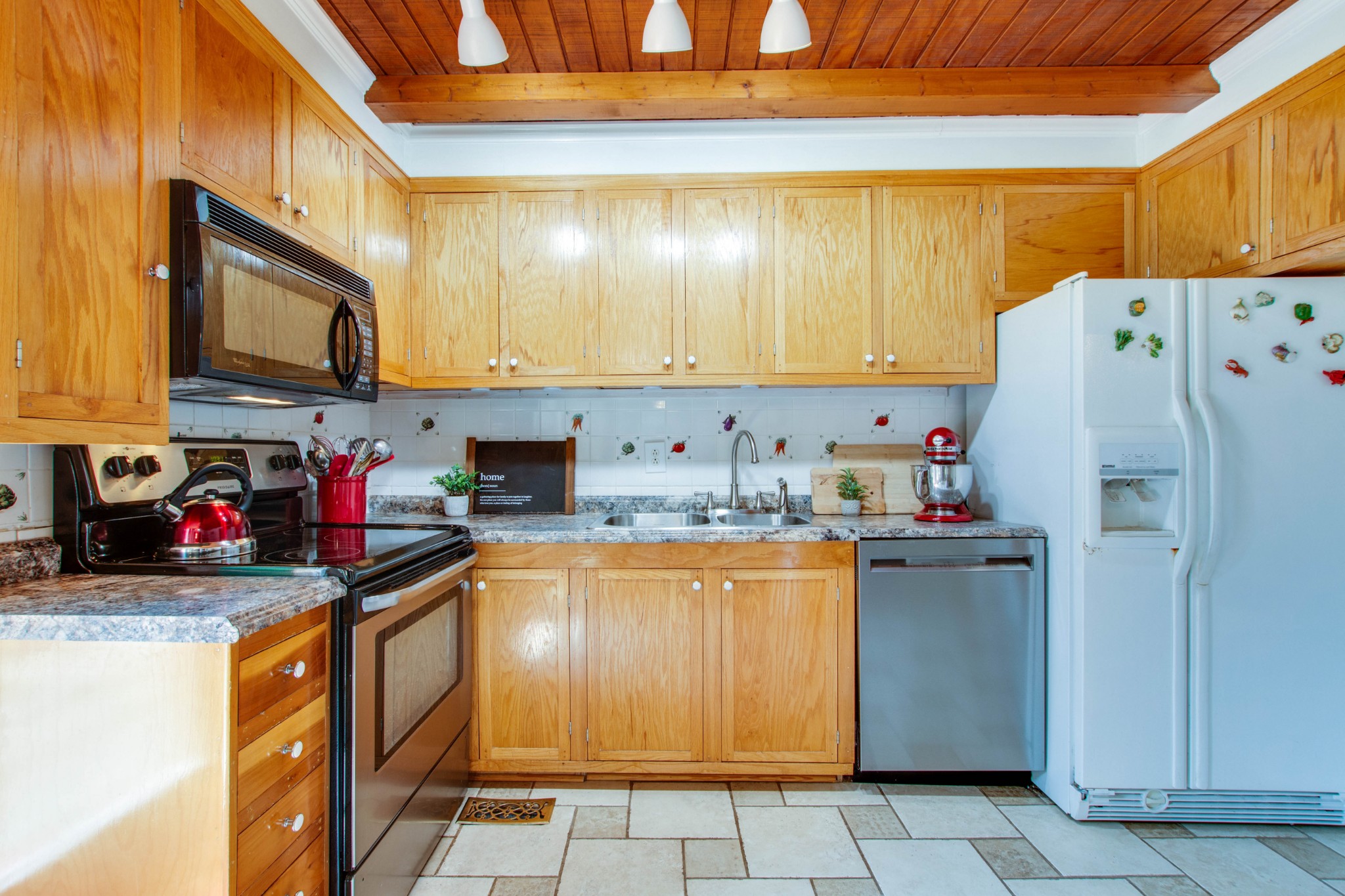 444 S Road Cottontown, TN 37048 - Photo 12 of 30 a kitchen with stainless steel appliances granite countertop a refrigerator sink and cabinets