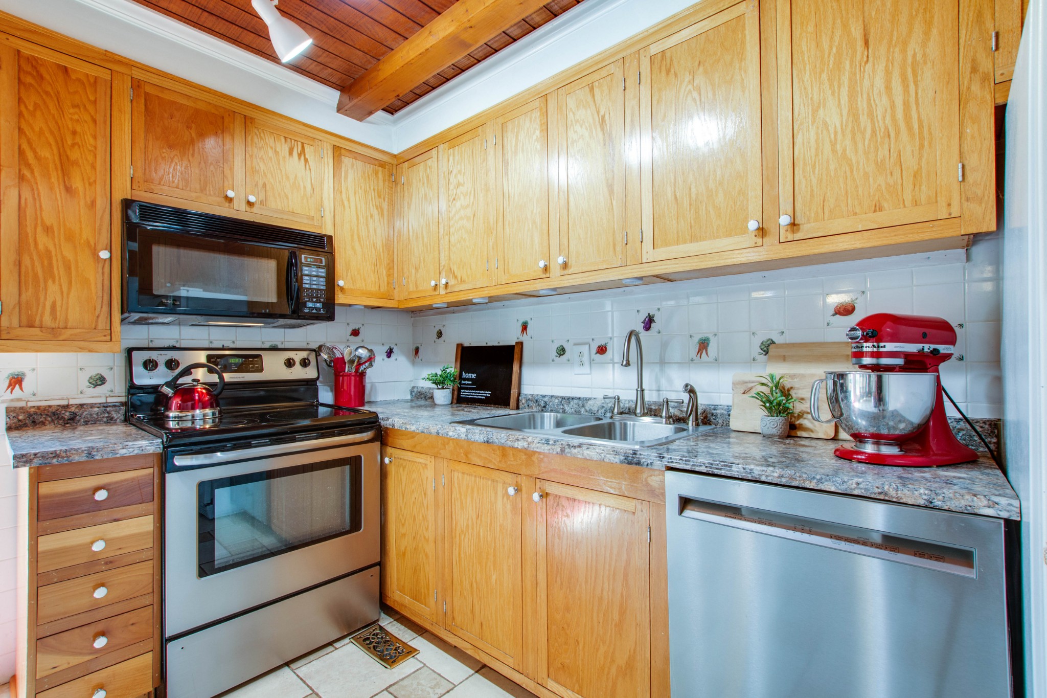 444 S Road Cottontown, TN 37048 - Photo 13 of 30 a kitchen with granite countertop a stove microwave and cabinets