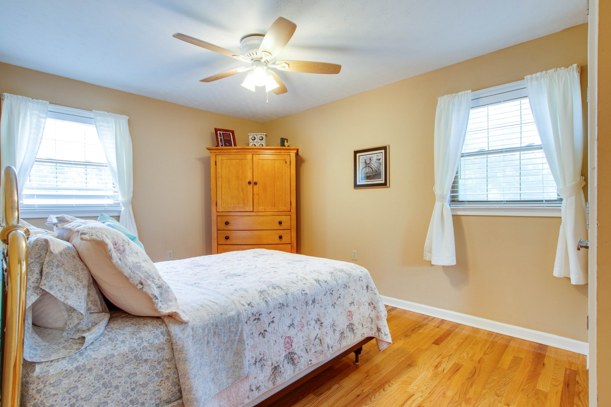 444 S Road Cottontown, TN 37048 - Photo 15 of 30 a bedroom with a bed and a chandelier