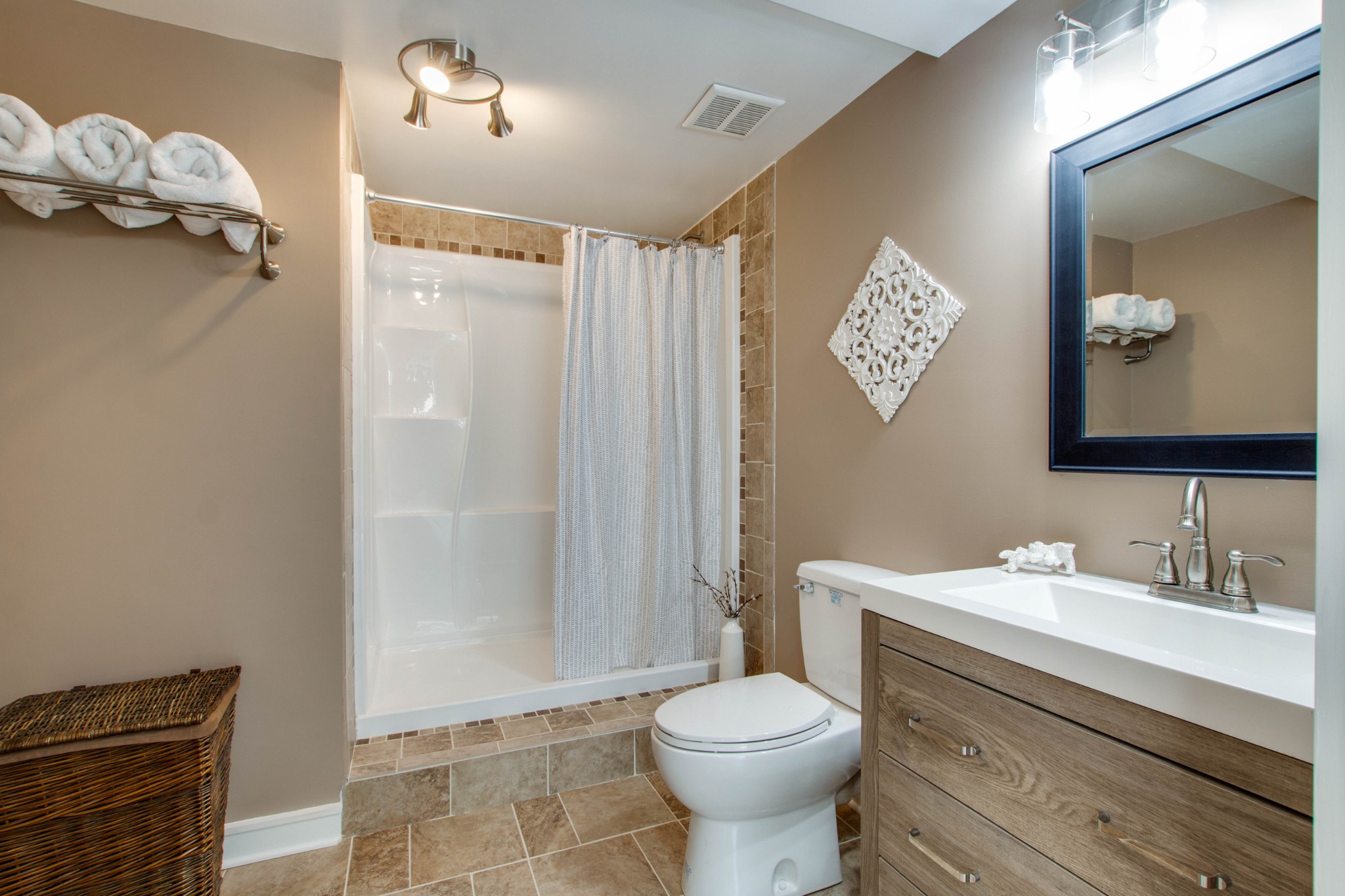 444 S Road Cottontown, TN 37048 - Photo 24 of 30 a bathroom with a toilet a sink and mirror