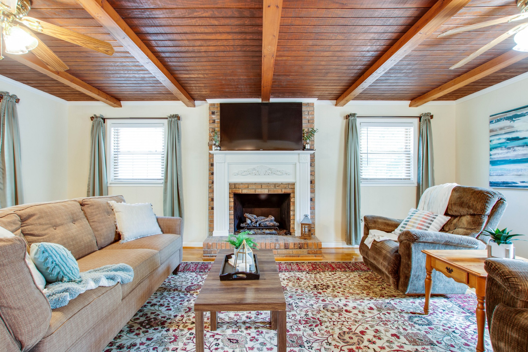 444 S Road Cottontown, TN 37048 - Photo 8 of 30 a living room with furniture a fireplace and a flat screen tv