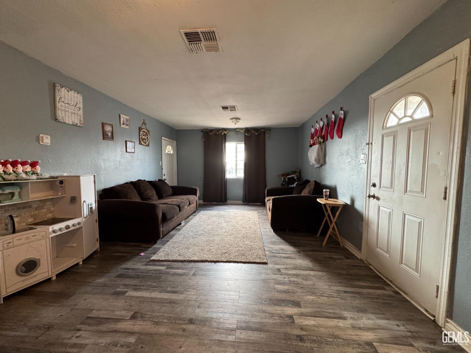 Undisclosed Address Bakersfield, CA 93305 - Photo 3 of 13 a living room with furniture and a chandelier