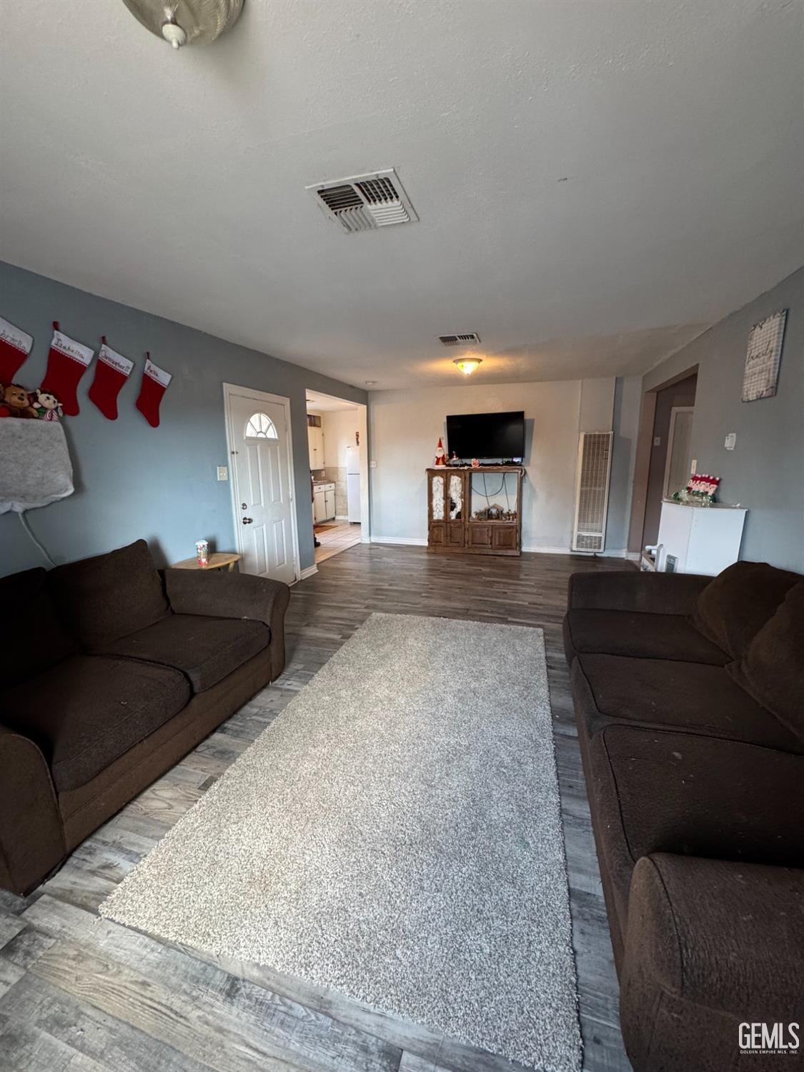 Undisclosed Address Bakersfield, CA 93305 - Photo 4 of 13 a living room with furniture and a couch