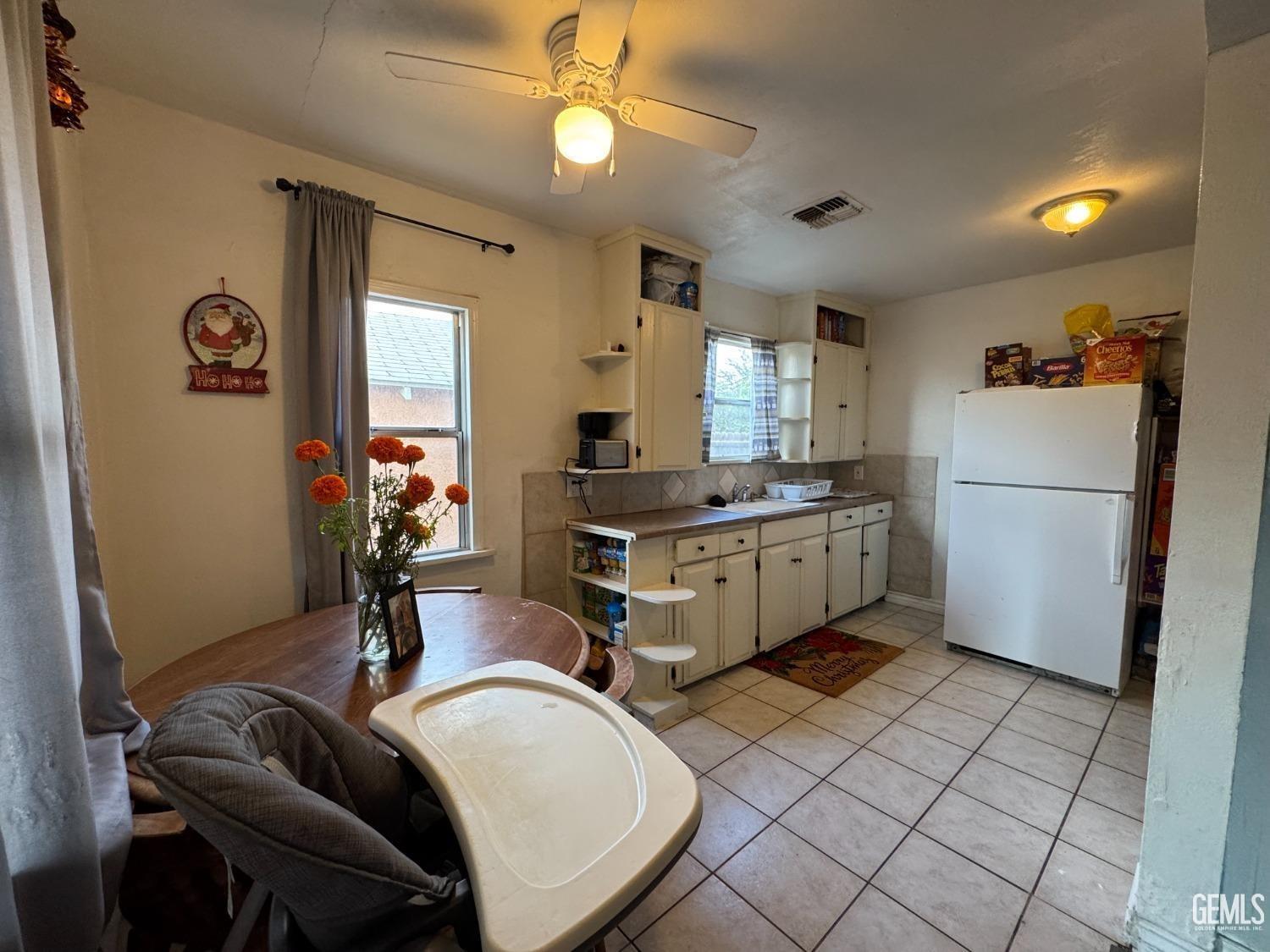 Undisclosed Address Bakersfield, CA 93305 - Photo 5 of 13 a kitchen that has a sink a stove and a refrigerator