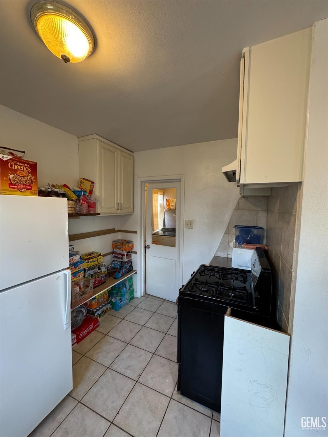 Undisclosed Address Bakersfield, CA 93305 - Photo 6 of 13 a kitchen with stainless steel appliances granite countertop a refrigerator and a stove