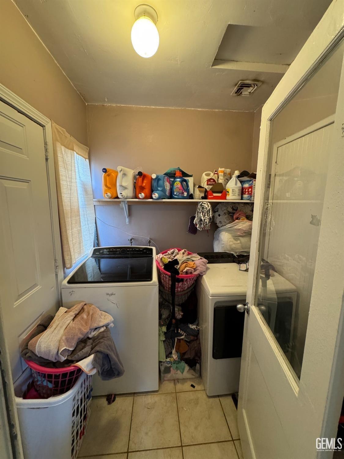 Undisclosed Address Bakersfield, CA 93305 - Photo 8 of 13 a utility room with dryer and washer