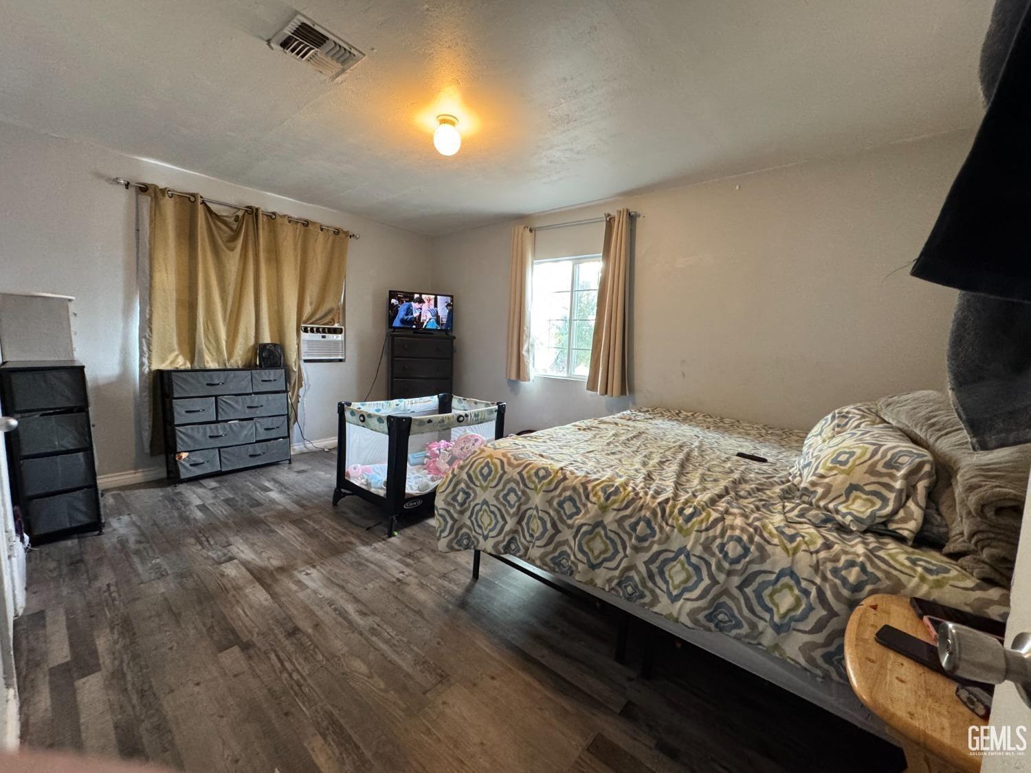 Undisclosed Address Bakersfield, CA 93305 - Photo 9 of 13 a bedroom with bed and window