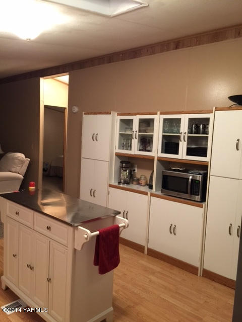 2310 Tear Road Grandview, WA 98930 - Photo 5 of 14 a kitchen with a refrigerator and a stove top oven