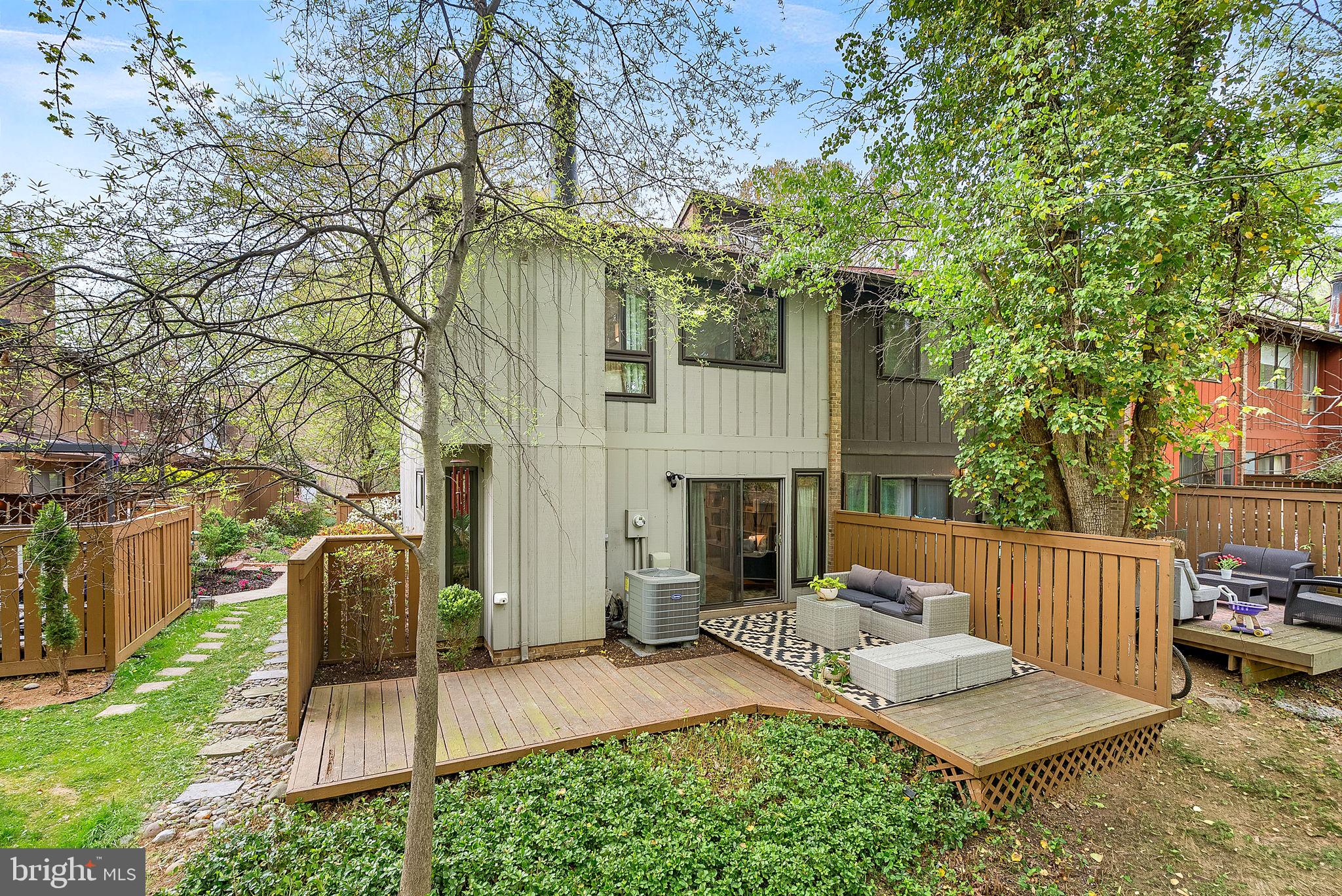 11907 Escalante Court Reston, VA 20191 - Photo 3 of 4 a view of house with backyard and furniture