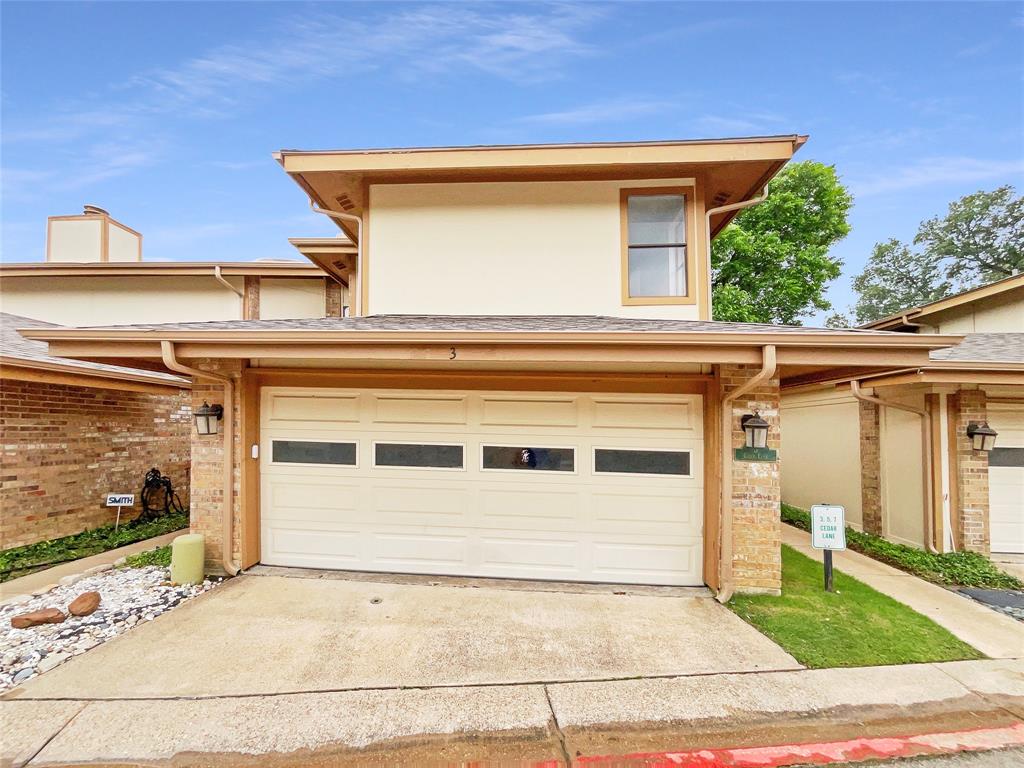 a view of a house with a garage