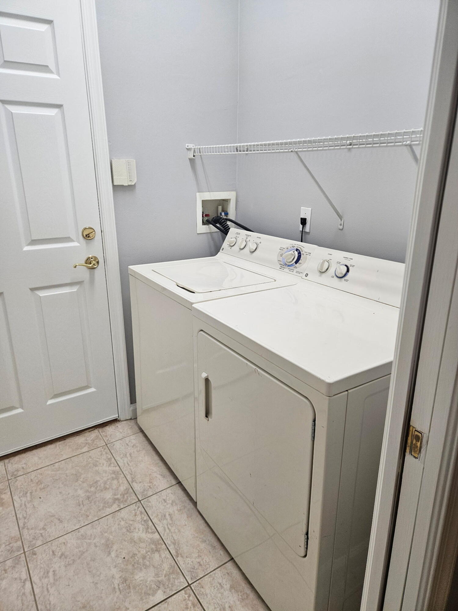 406 Springview Loop Port St. Lucie, FL 34986 - Photo 15 of 23 a utility room with dryer and washer
