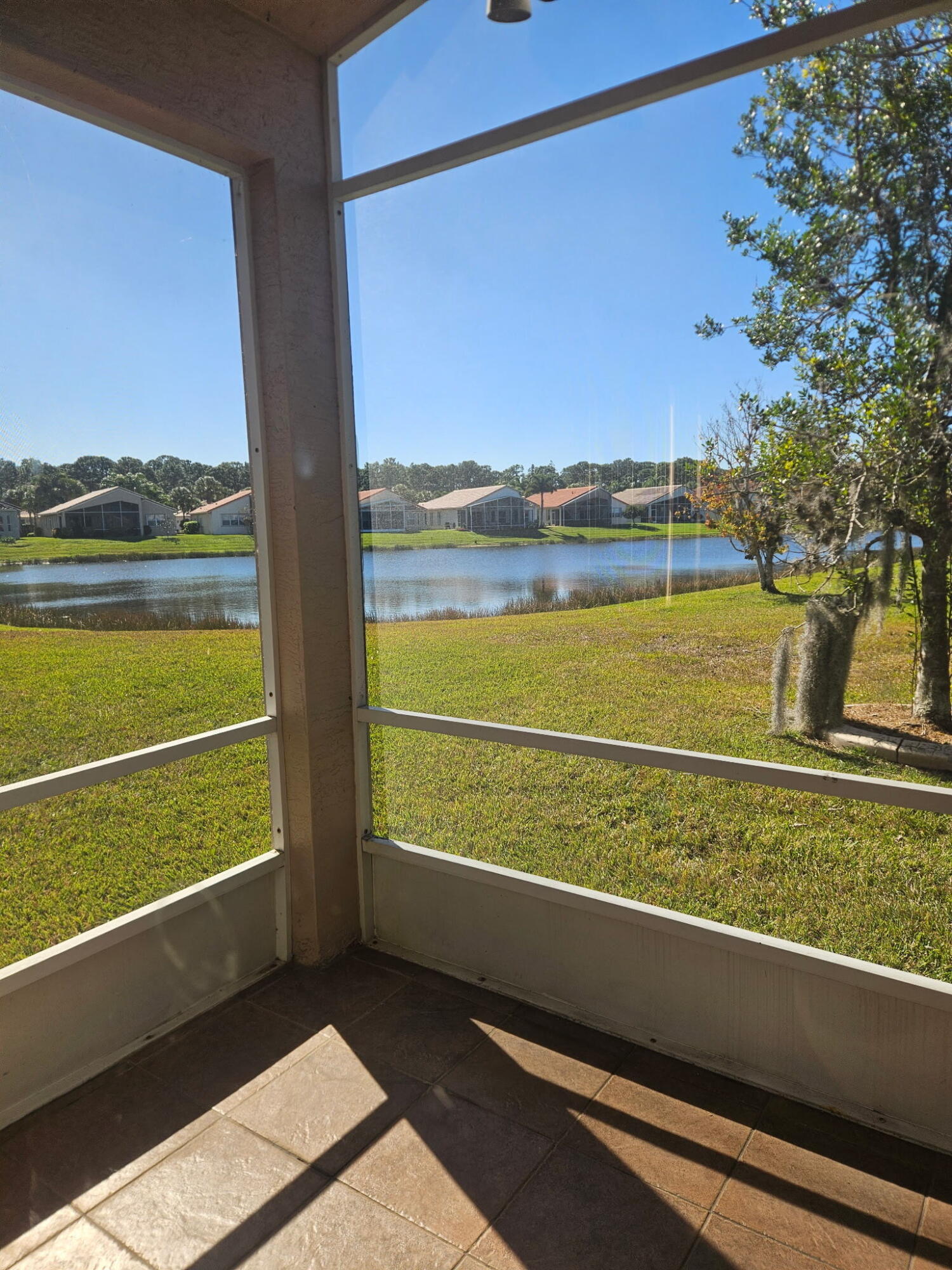 406 Springview Loop Port St. Lucie, FL 34986 - Photo 2 of 23 a view of a two room with a big yard