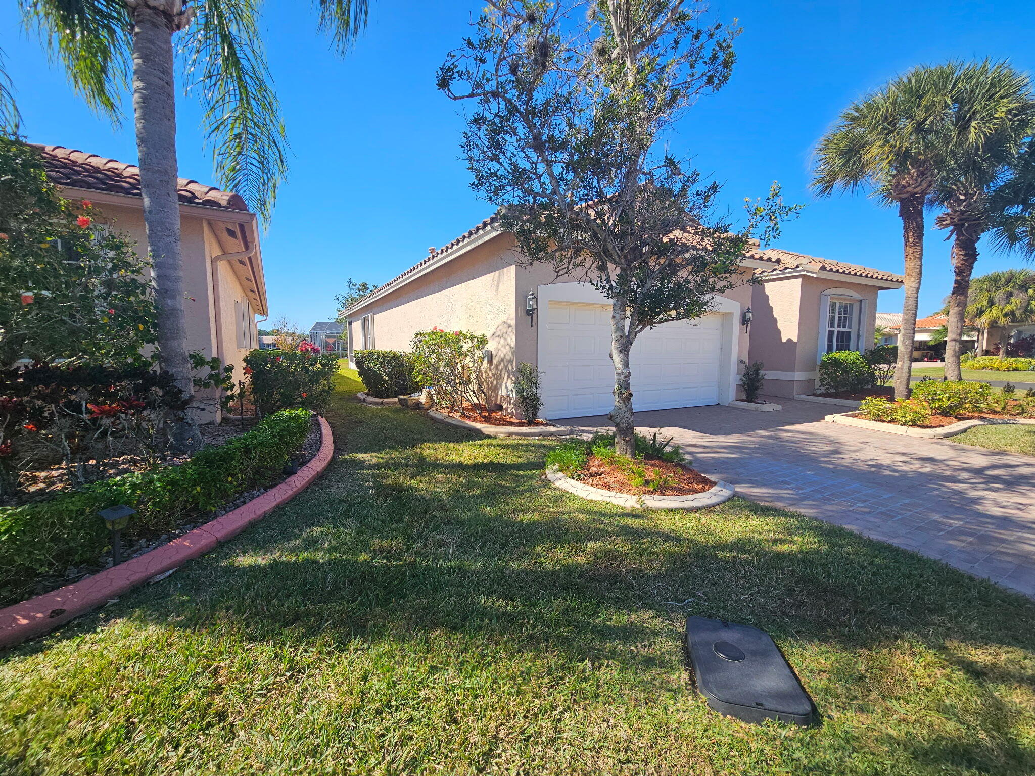 406 Springview Loop Port St. Lucie, FL 34986 - Photo 23 of 23 a view of a house with a yard