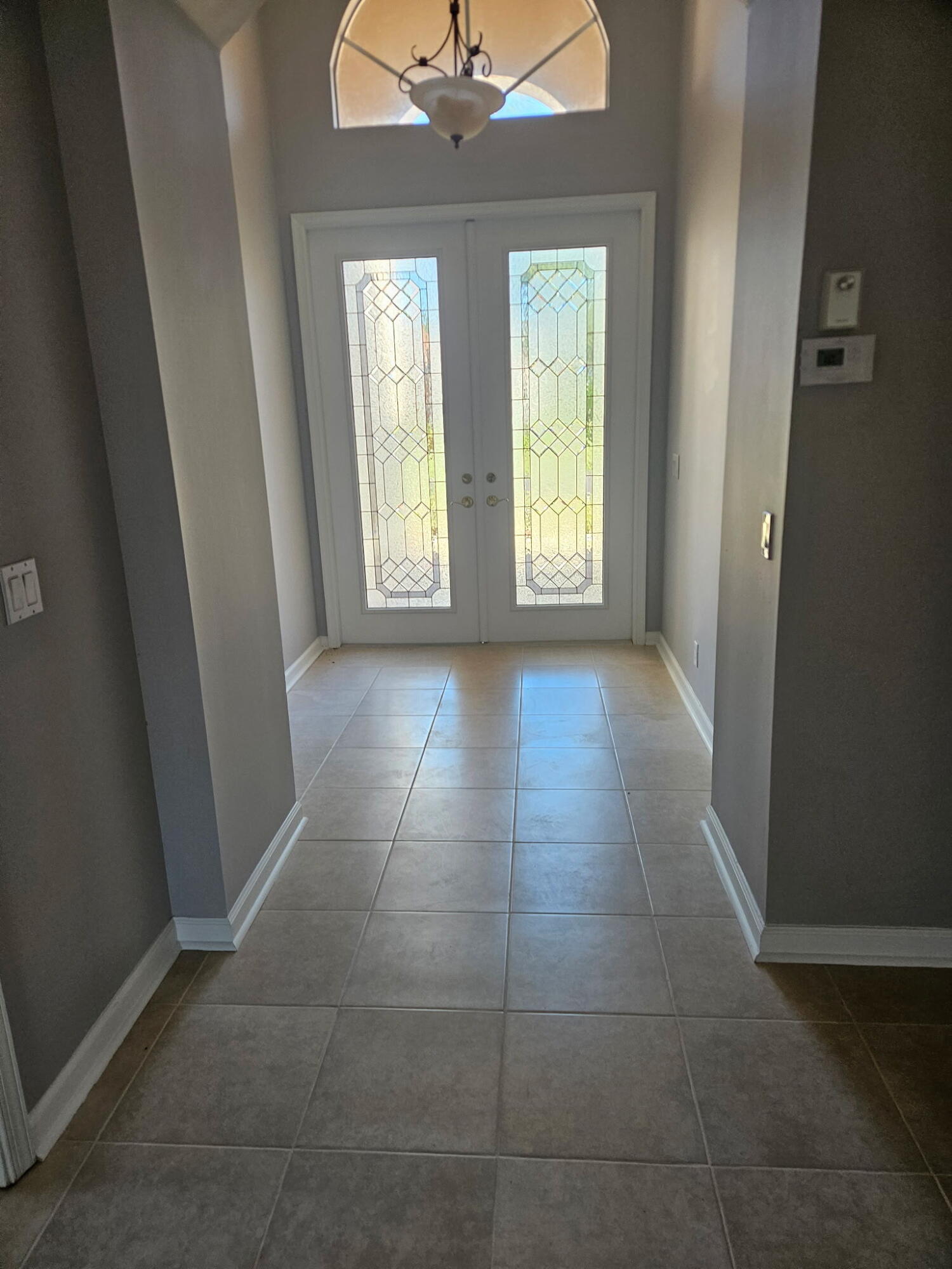 406 Springview Loop Port St. Lucie, FL 34986 - Photo 8 of 23 a view of an empty room with windows and closet