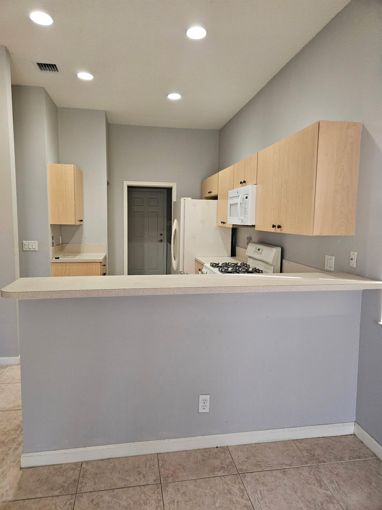 406 Springview Loop Port St. Lucie, FL 34986 - Photo 10 of 23 a bathroom with a sink and a mirror