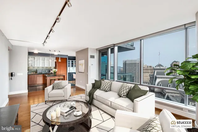 a living room with furniture and a large window