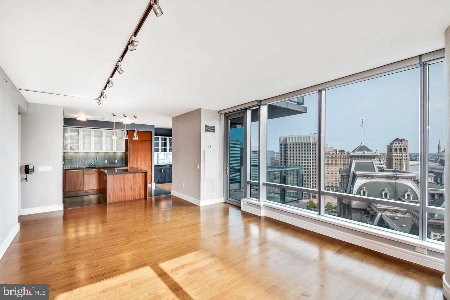 1414 South Penn Square, Unit 20B Philadelphia, PA 19102 - Photo 11 of 54 a view of a living room with furniture and floor to ceiling window