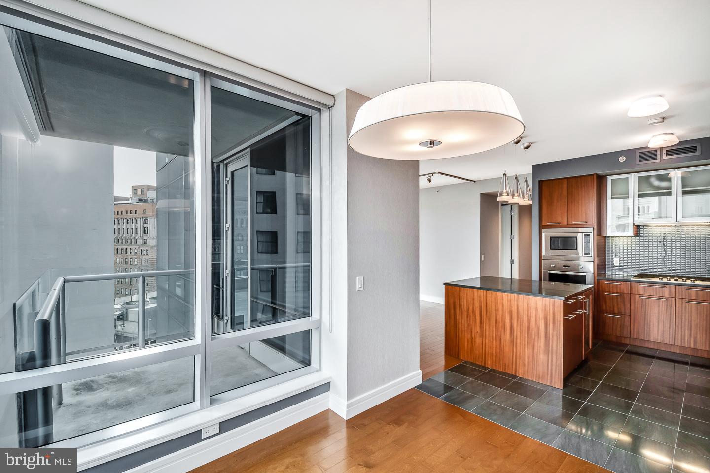 1414 South Penn Square, Unit 20B Philadelphia, PA 19102 - Photo 18 of 54 a kitchen with stainless steel appliances granite countertop a stove and a refrigerator