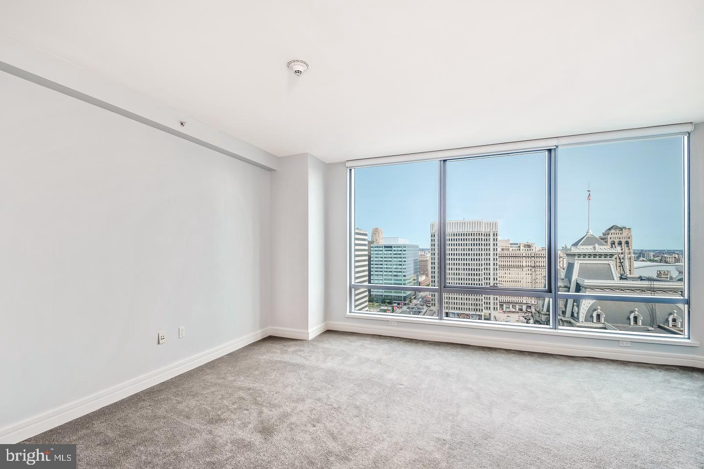 1414 South Penn Square, Unit 20B Philadelphia, PA 19102 - Photo 21 of 54 a view of a big room with windows and chandelier fan
