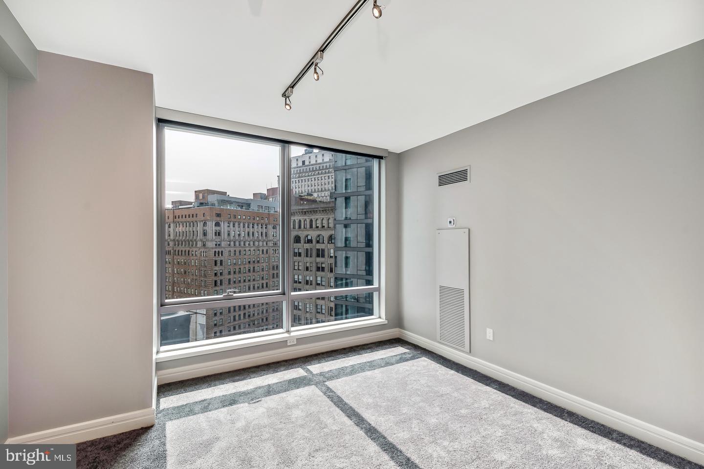 1414 South Penn Square, Unit 20B Philadelphia, PA 19102 - Photo 29 of 54 a view of an empty room with glass door