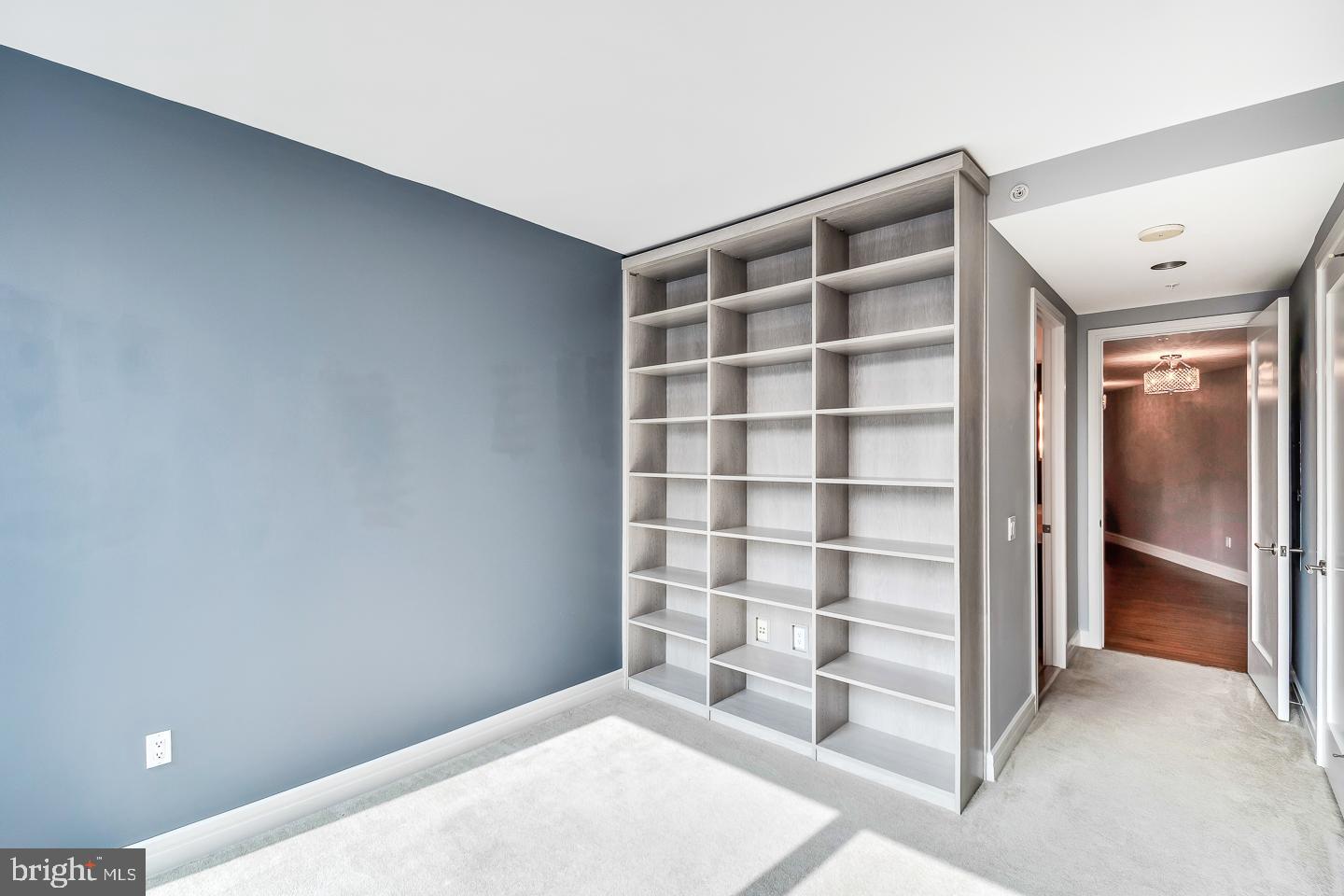 1414 South Penn Square, Unit 20B Philadelphia, PA 19102 - Photo 35 of 54 a view of an empty room with a cabinet and a window