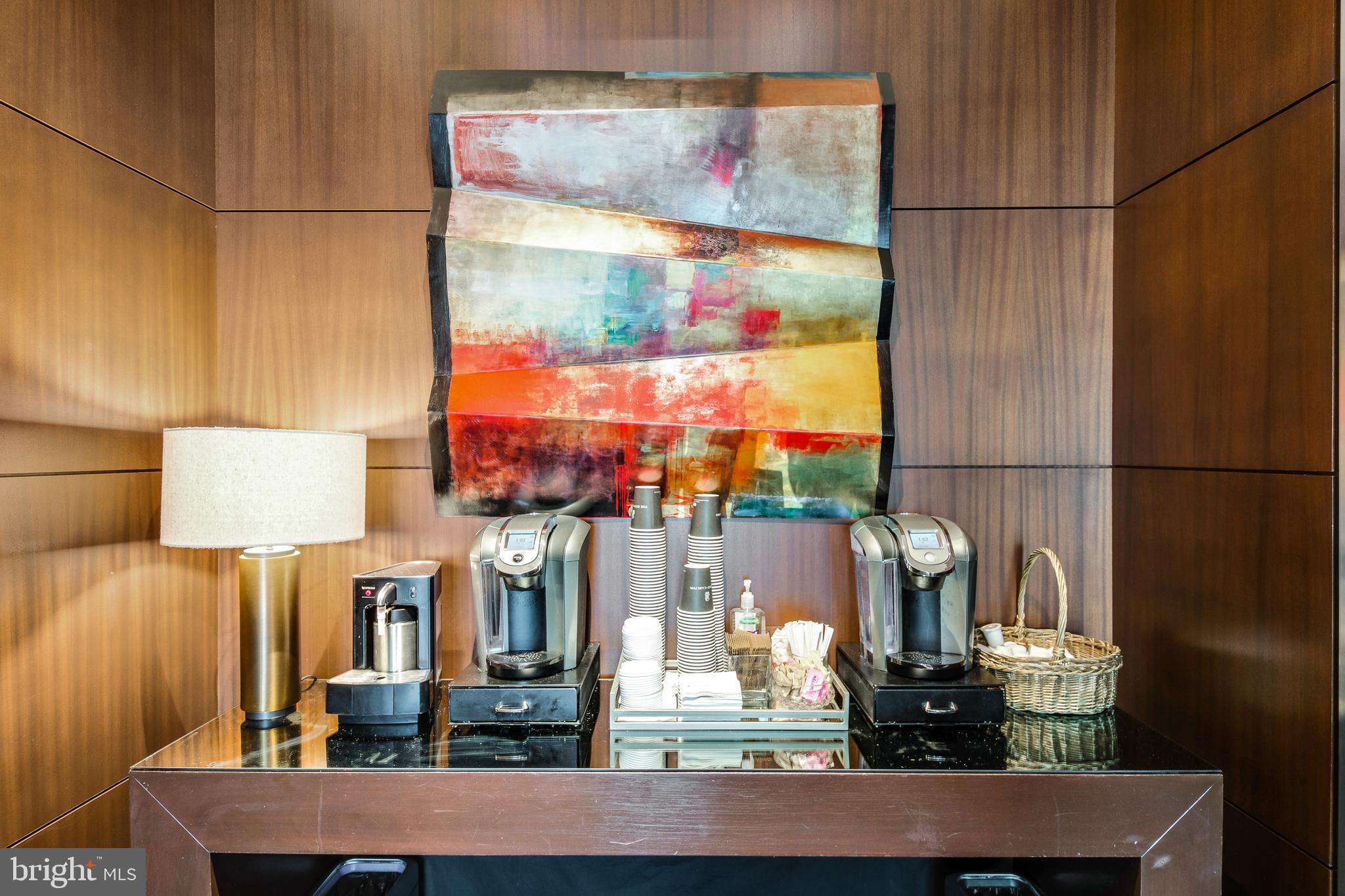 1414 South Penn Square, Unit 20B Philadelphia, PA 19102 - Photo 42 of 54 a room with lots of frames and a lamp