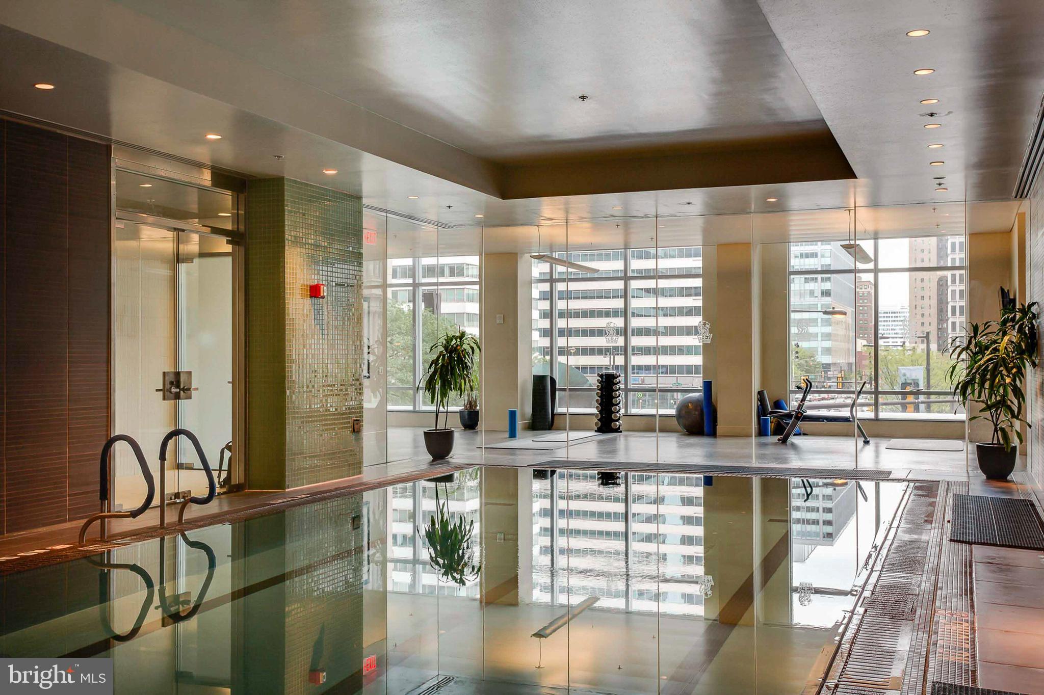1414 South Penn Square, Unit 20B Philadelphia, PA 19102 - Photo 49 of 54 a very nice looking living room with a large window and wooden floor