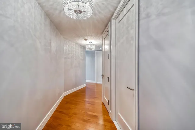 a view of a hallway with a chandelier