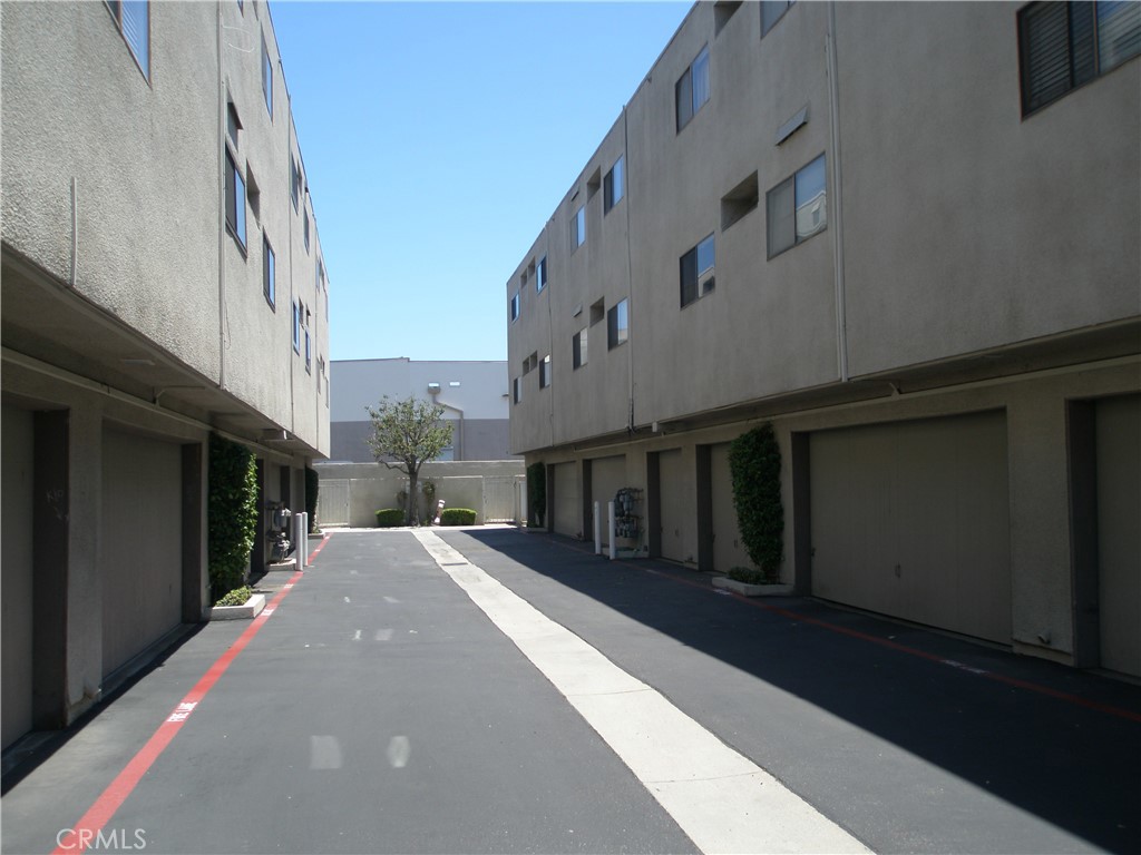 12592 Montecito Road, Unit 9 Seal Beach, CA 90740 - Photo 4 of 16 a view of a building with a street