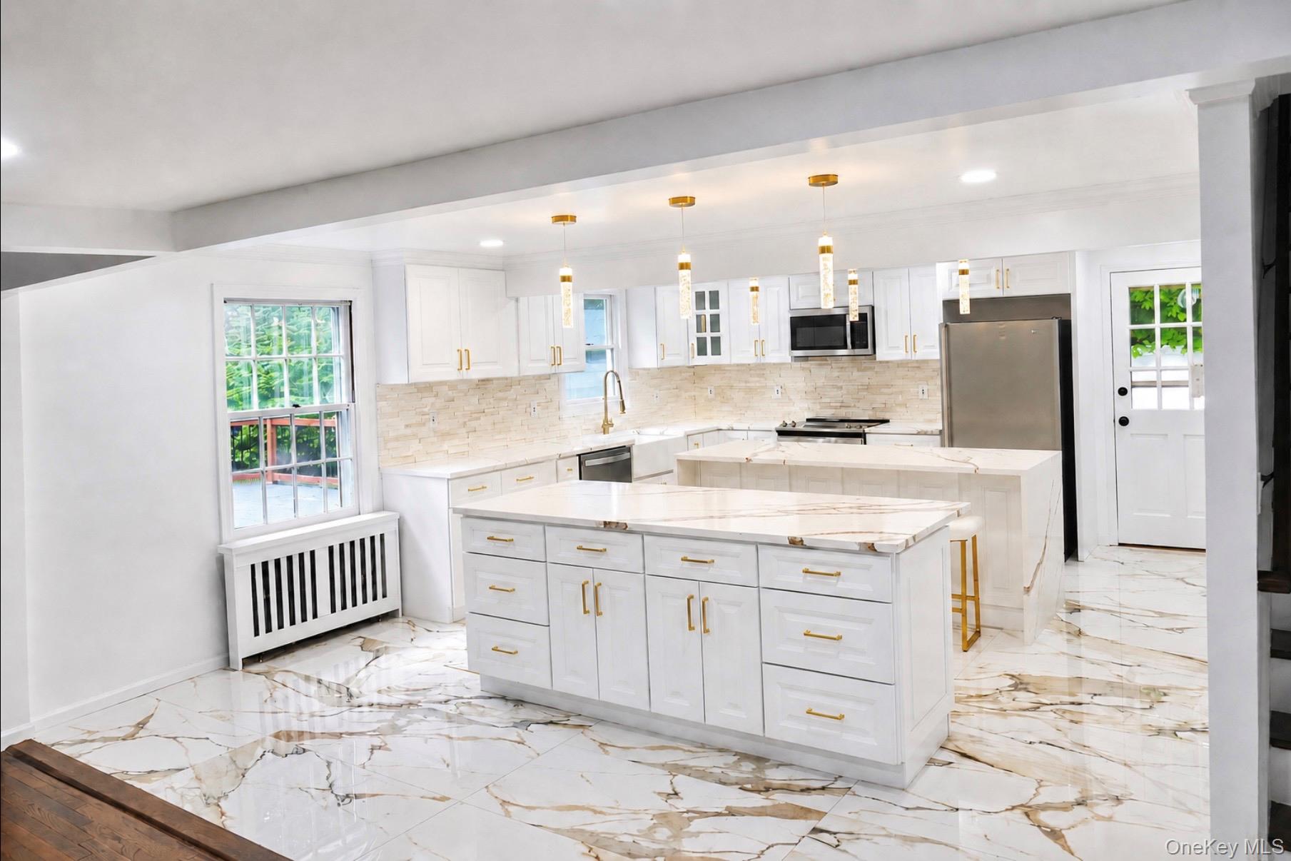 80 Mt Pleasant Road Smithtown, NY 11787 - Photo 2 of 27 a kitchen with stainless steel appliances granite countertop a sink stove and refrigerator