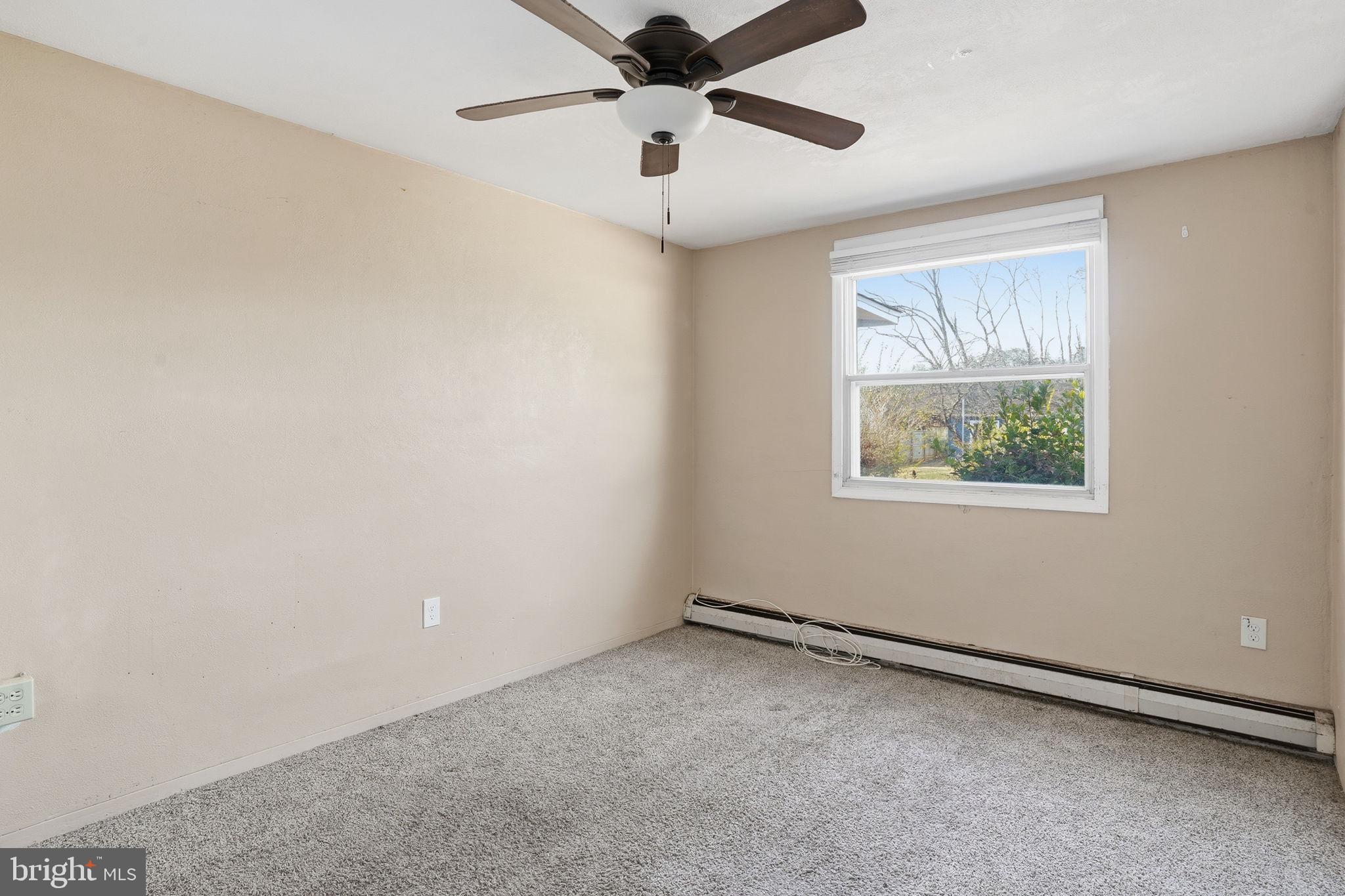610 Wardour Road Glen Burnie, MD 21061 - Photo 13 of 19 an empty room with a window and a fan