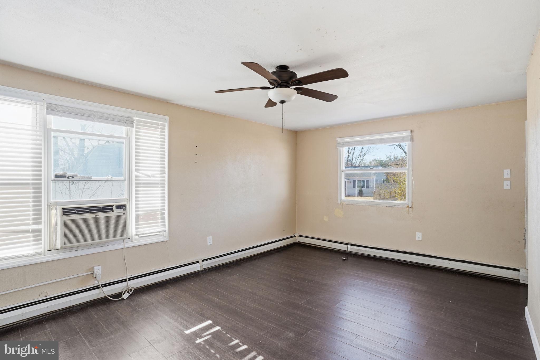 610 Wardour Road Glen Burnie, MD 21061 - Photo 15 of 19 wooden floor in an empty room with a window