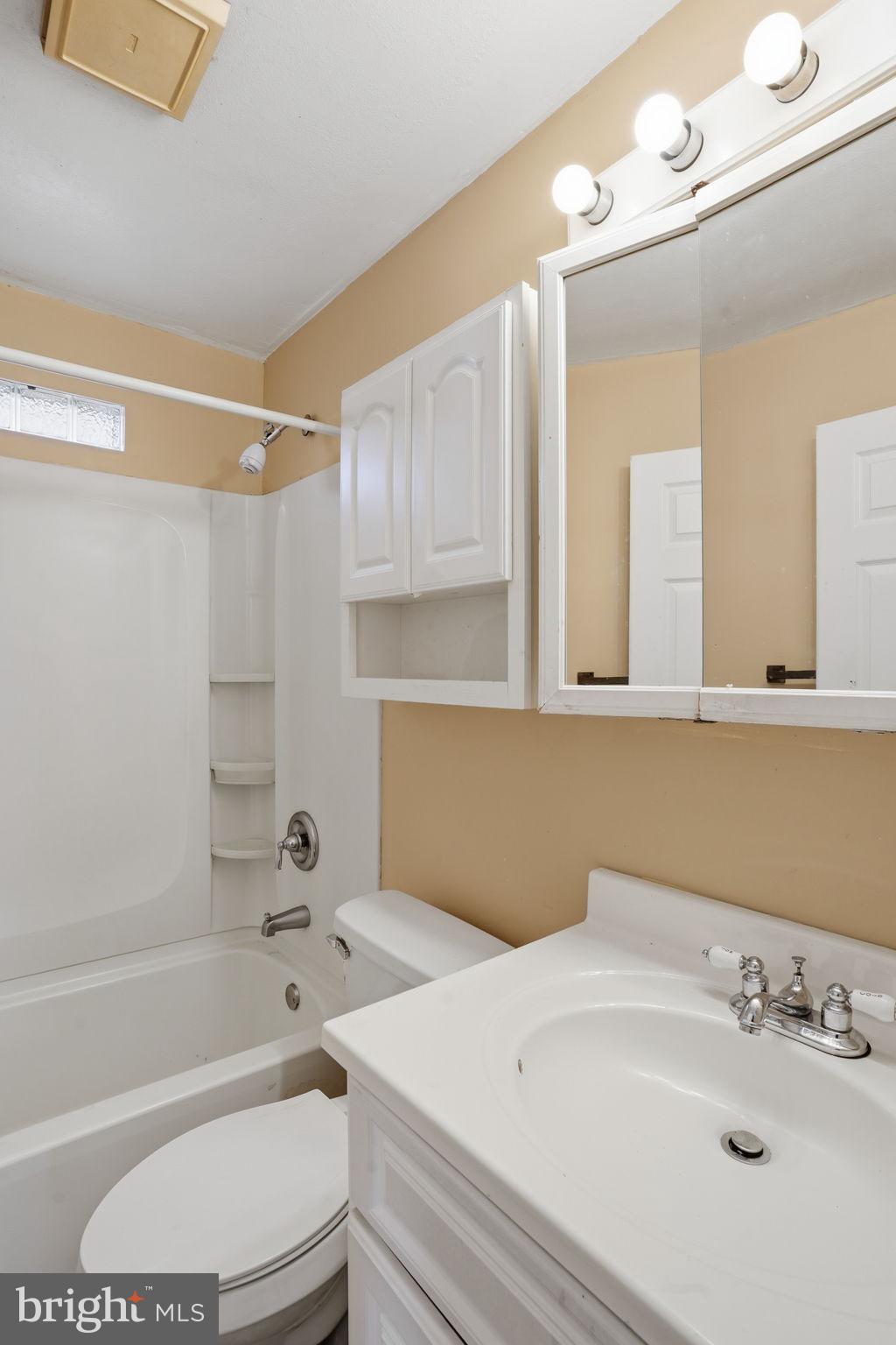 610 Wardour Road Glen Burnie, MD 21061 - Photo 16 of 19 a bathroom with a sink a toilet and shower