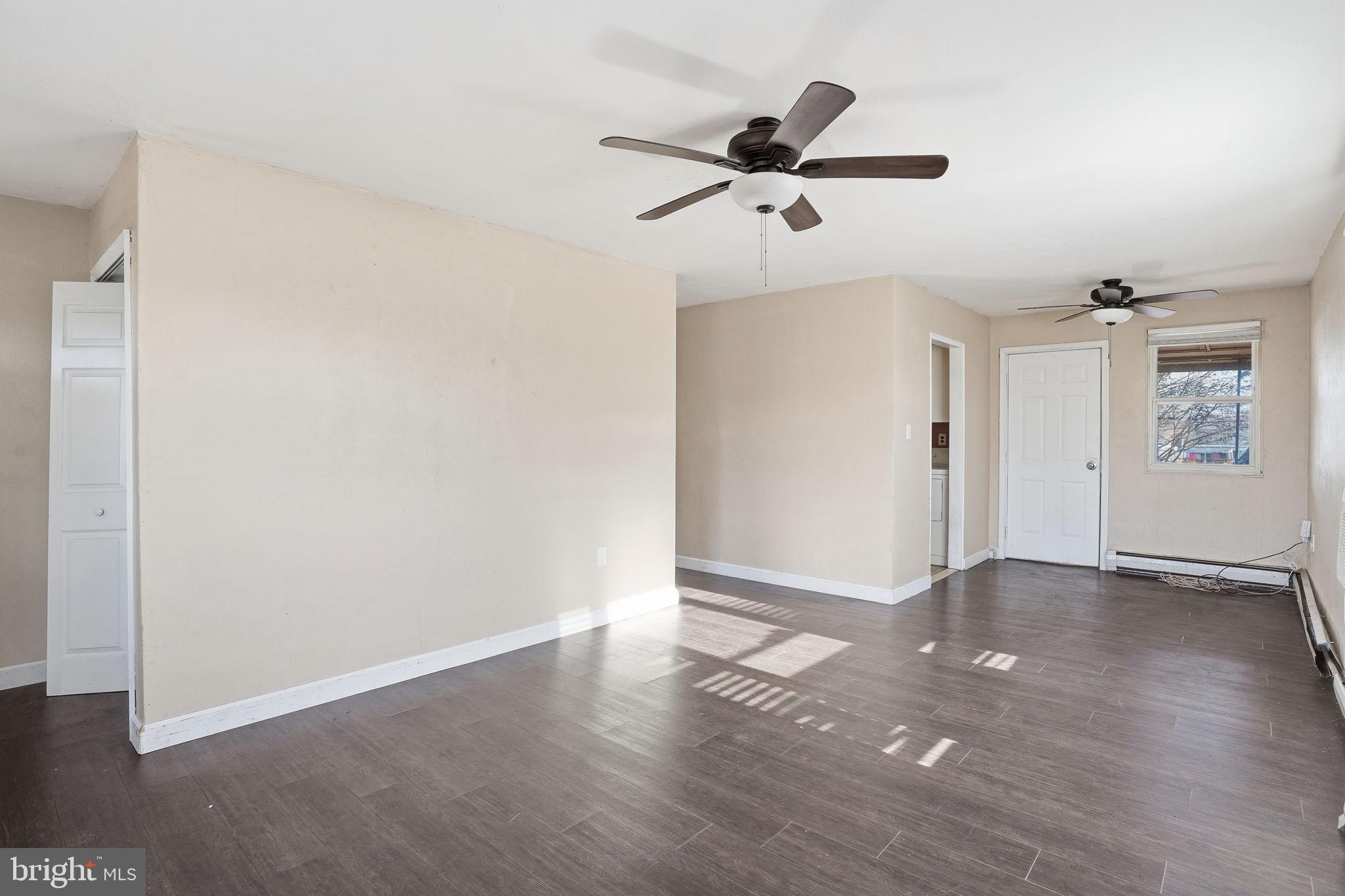 610 Wardour Road Glen Burnie, MD 21061 - Photo 5 of 19 an empty room with wooden floor closet and windows
