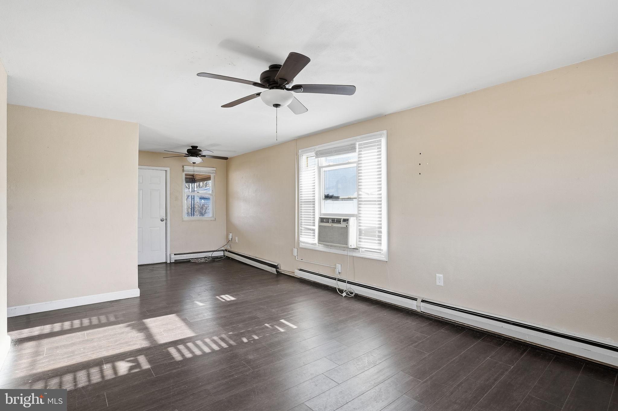 610 Wardour Road Glen Burnie, MD 21061 - Photo 6 of 19 wooden floor in an empty room with a window