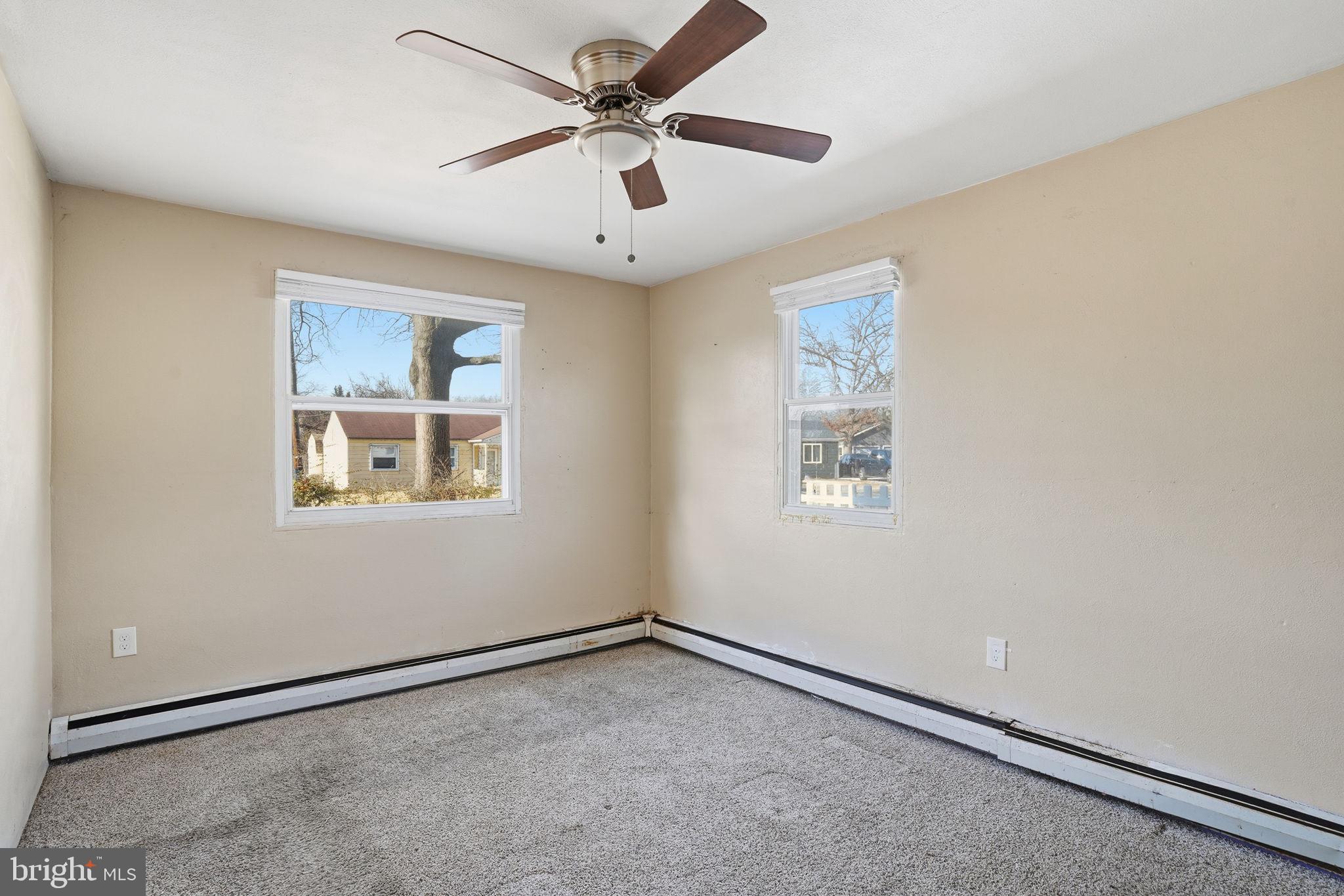 610 Wardour Road Glen Burnie, MD 21061 - Photo 8 of 19 an empty room with windows and fan