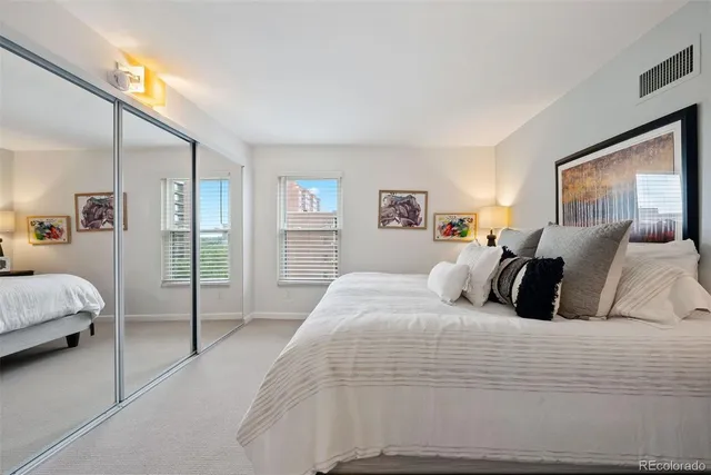 a sink with a granite countertop cabinets