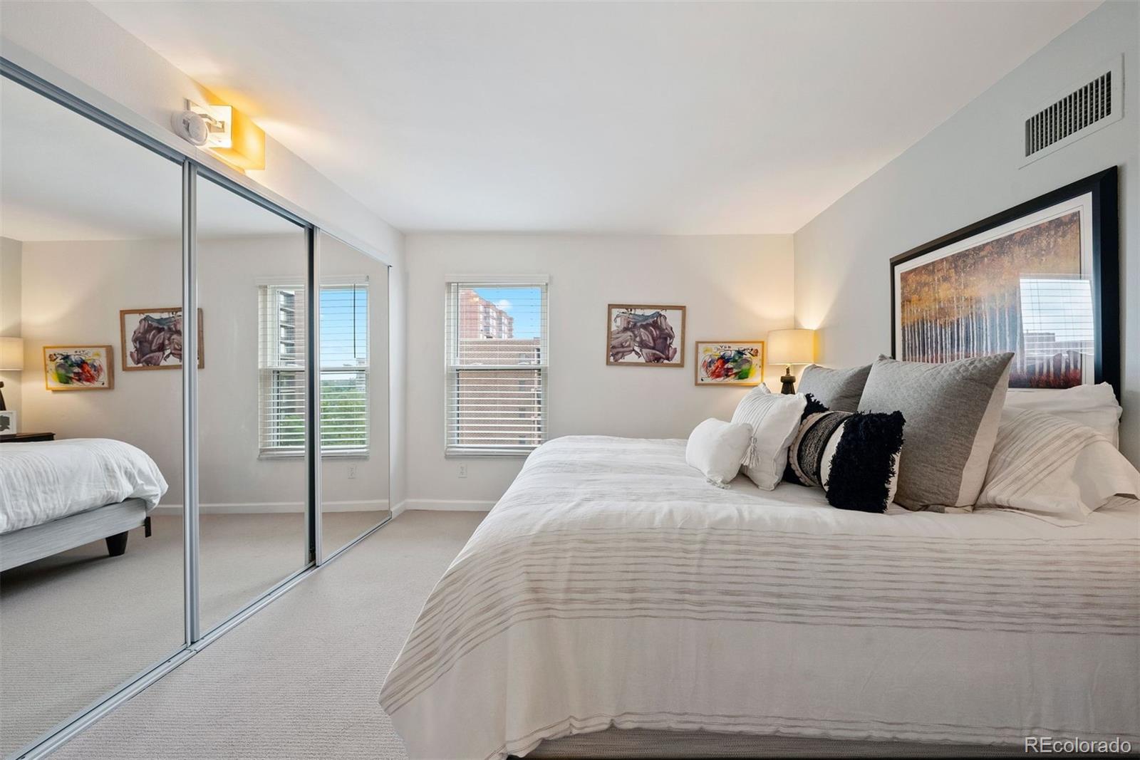 2 Adams Street, Unit 806 Denver, CO 80206 - Photo 16 of 34 a large white bed in a white room