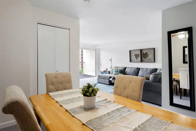 a bedroom with a bed and glass windows