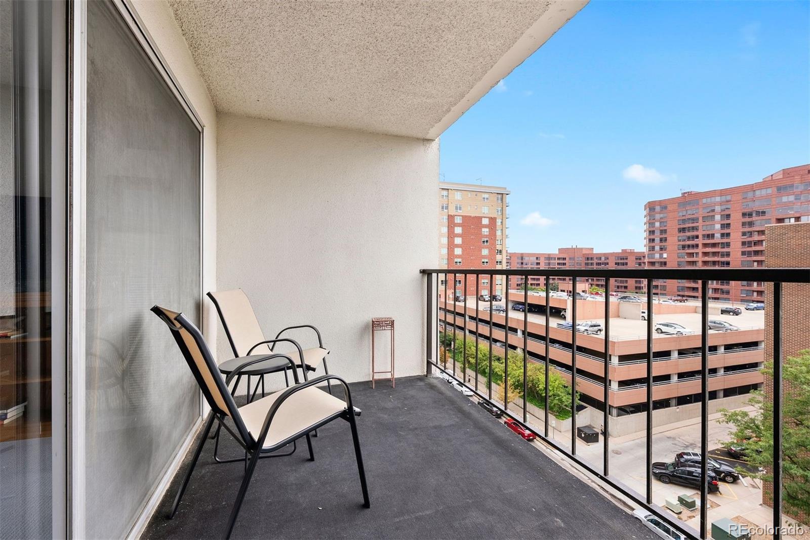 2 Adams Street, Unit 806 Denver, CO 80206 - Photo 24 of 34 a view of a balcony with chairs