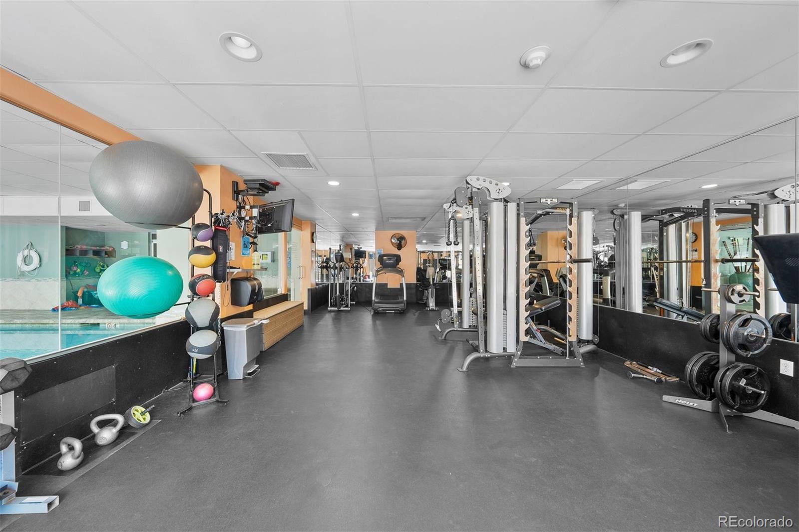 2 Adams Street, Unit 806 Denver, CO 80206 - Photo 27 of 34 a view of a room with gym equipment