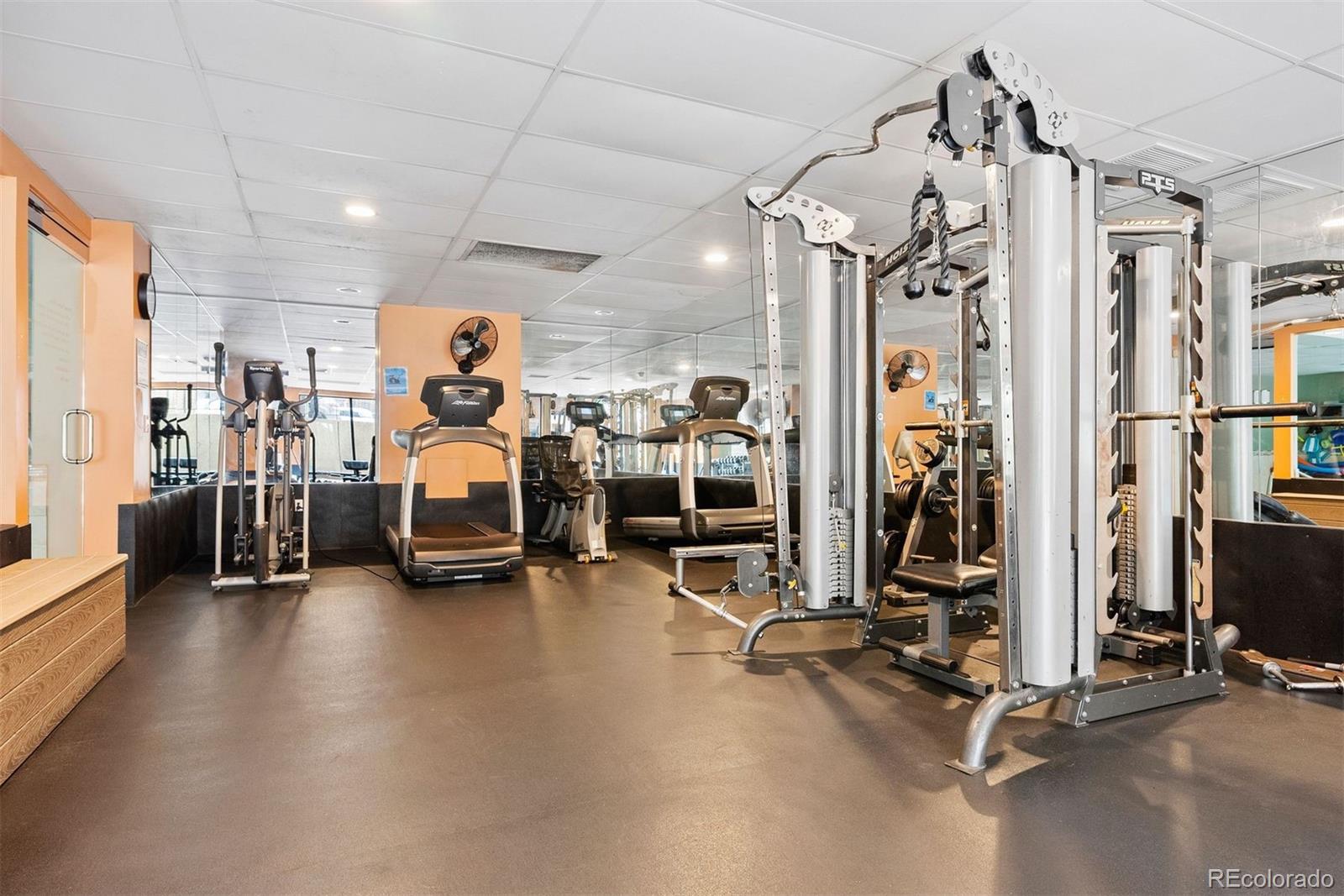 2 Adams Street, Unit 806 Denver, CO 80206 - Photo 28 of 34 a view of a room with gym equipment